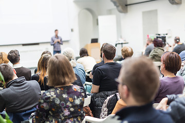 Image showing Man giving presentation in lecture hall at university.