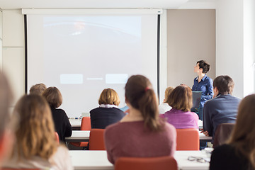 Image showing Woman giving presentation in lecture hall at university.