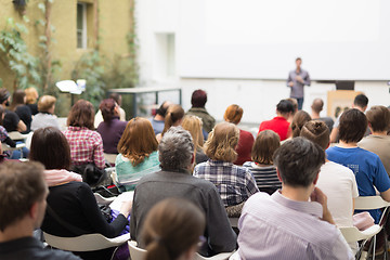 Image showing Man giving presentation in lecture hall at university.