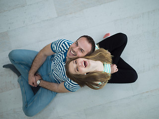 Image showing couple sitting with back to each other on floor