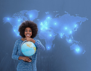 Image showing black woman holding Globe of the world