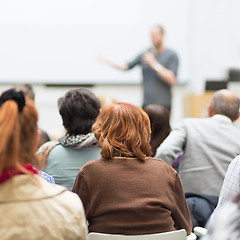 Image showing Man giving presentation in lecture hall at university.