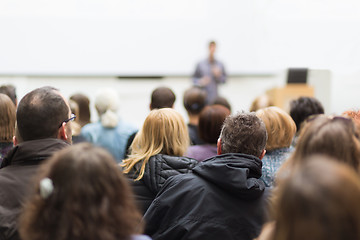 Image showing Man giving presentation in lecture hall at university.