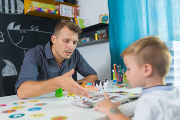 Image showing Cute little boy at speechtherapist session.