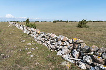 Image showing Fence of old traditional stone wall