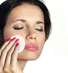 Image showing woman who cleans skin by tonic