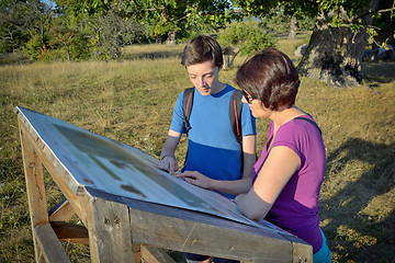 Image showing Family looking at signboard