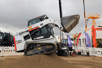 Image showing Operating Bobcat on Sand Work Site