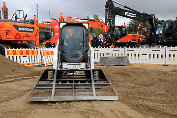 Image showing Leveling Ground With Bobcat Track Loader 