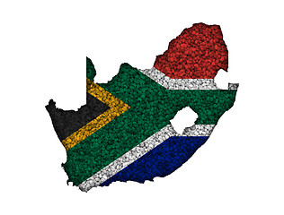 Image showing Map and flag of South Africa on poppy seeds