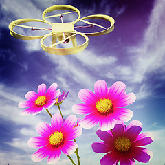 Image showing Drone, quadrocopter, with photo camera against the sky and Beaut