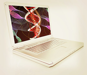 Image showing Laptop with dna medical model background on laptop screen. 3d il