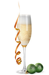 Image showing Glass of champagne and Christmas balls