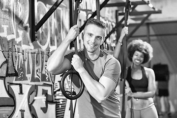 Image showing Portrait of multiethnic couple  after workout at gym