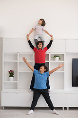 Image showing young boys posing line up piggyback