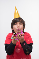 Image showing kid blowing confetti