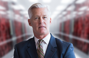 Image showing Senior businessman in server room