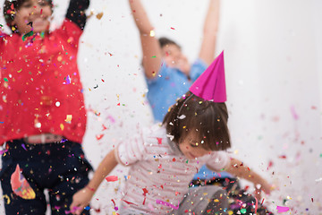 Image showing kids  blowing confetti