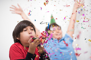 Image showing kids  blowing confetti