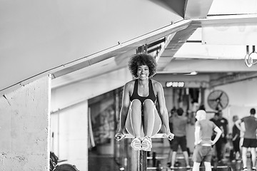 Image showing black woman doing parallel bars Exercise