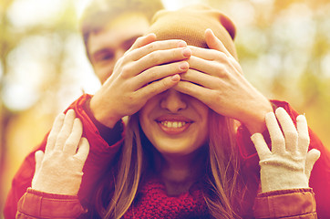 Image showing happy young couple having fun in autumn park