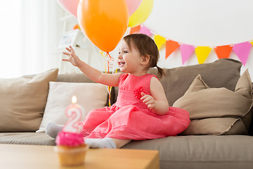 Image showing happy baby girl on birthday party at home