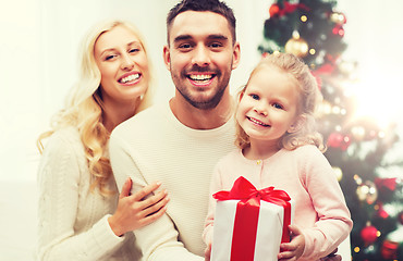 Image showing happy family at home with christmas gift box