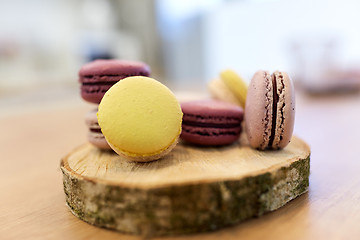 Image showing different macarons on wooden stand