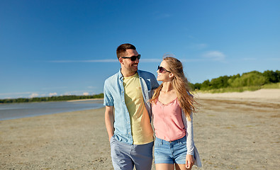 Image showing happy couple hugging on summer beach