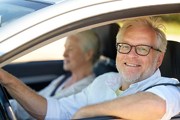 Image showing happy senior couple driving in car