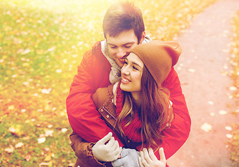 Image showing happy young couple hugging in autumn park