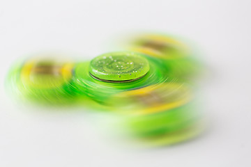 Image showing close up of lime green spinning fidget spinner