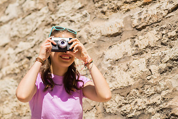 Image showing teenage girl or woman with vintage camera outdoors