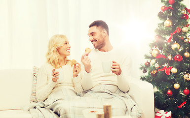 Image showing happy couple at home with christmas tree