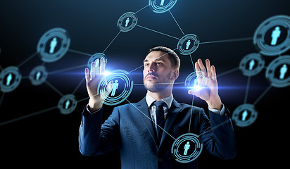 Image showing businessman with virtual network contacts