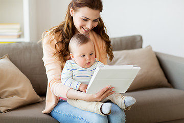 Image showing happy mother with baby and tablet pc at home