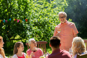 Image showing happy family having dinner or summer garden party