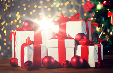 Image showing gift boxes and red balls under christmas tree