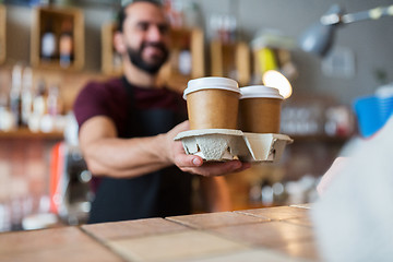 Image showing man or bartender serving customer at coffee shop