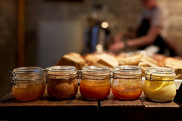 Image showing jars with craft jam or sauce at grocery store