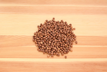 Image showing Black chickpeas on wood