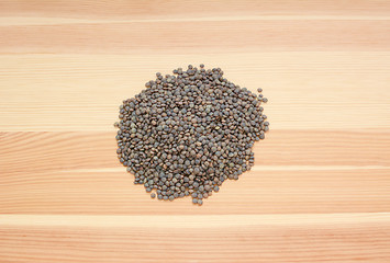 Image showing Marbled dark green lentils on wood