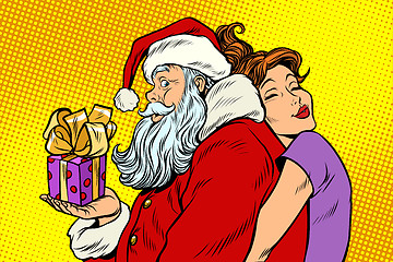 Image showing Santa Claus and beautiful woman, a surprise Christmas gift