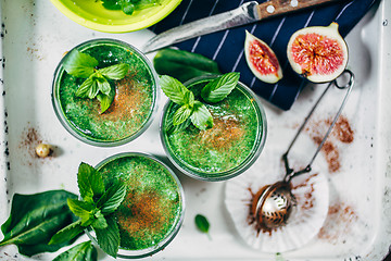 Image showing Green smoothies with leaves of fresh mint