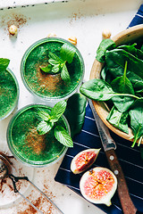 Image showing Green smoothies with leaves of fresh mint