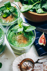 Image showing Green smoothies with leaves of fresh mint