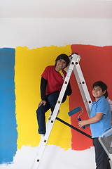 Image showing boys painting wall