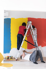 Image showing boys painting wall