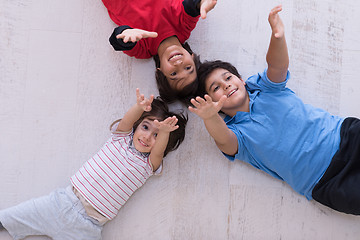 Image showing young boys having fun on the floor