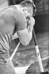 Image showing man workout with hammer and tractor tire